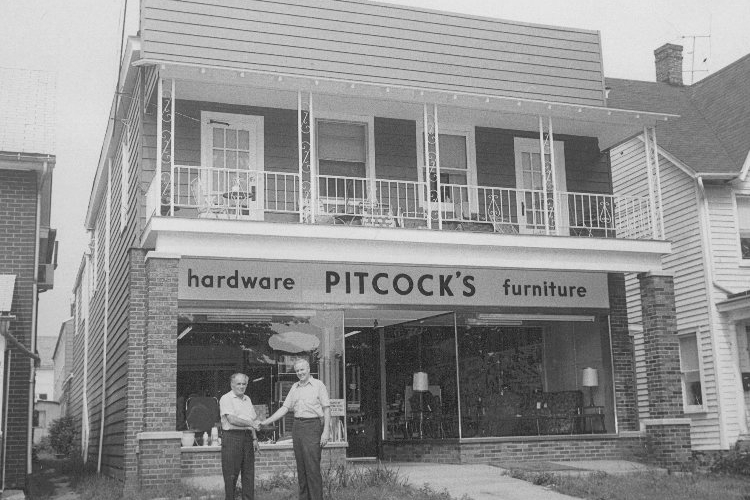 George and Troutie in front of Pitcock's Hardware at 408 N. Union, HdG