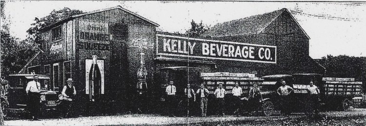 vintage photo of Kelly Beverage Co with trucks and staff in front of building, Havre de Grace