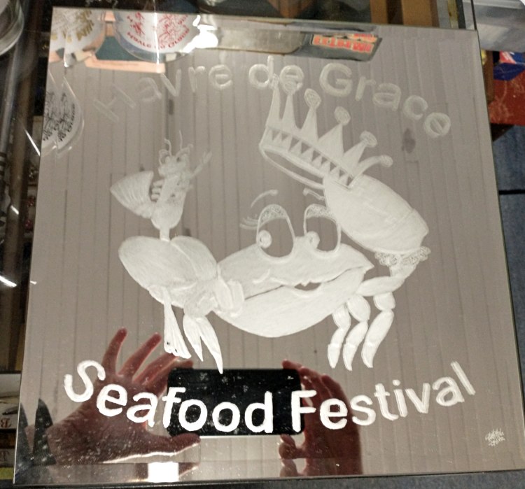 souvenir mirror with the Crab and Havre de Grace Seafood Festival etched on it.