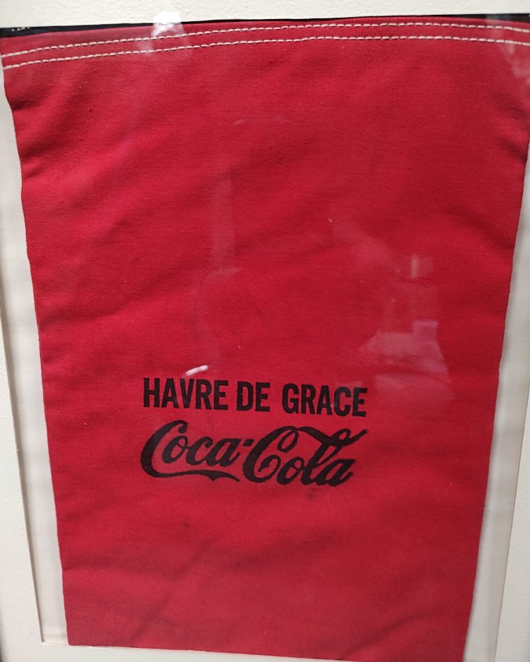 a red money bag from the Havre de Grace Coca-Cola Company
