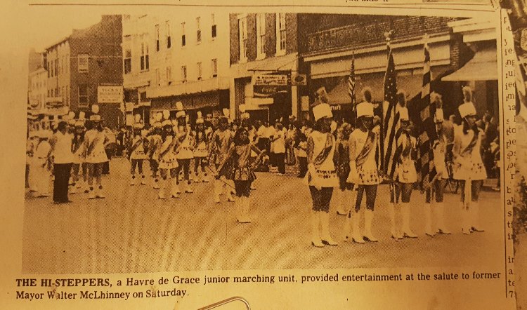 A 1974 newspaper photo of the Havre de Grace Hi-Steppers marching in the 200 block of N. Washington Street celebrating the former Mayor Walter McLhinney for Mr. Mac Day!