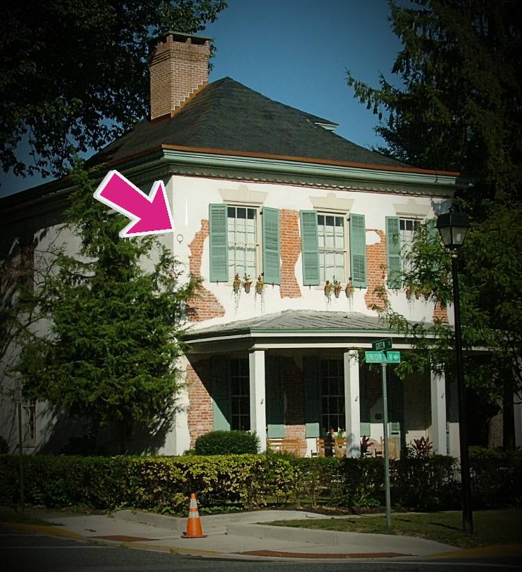 photo of Aveilhe-Goldsborough house at 300 N. Union in Havre de Grace, arrow pointing out where War of 1812 Cannonball landed in the front facade.