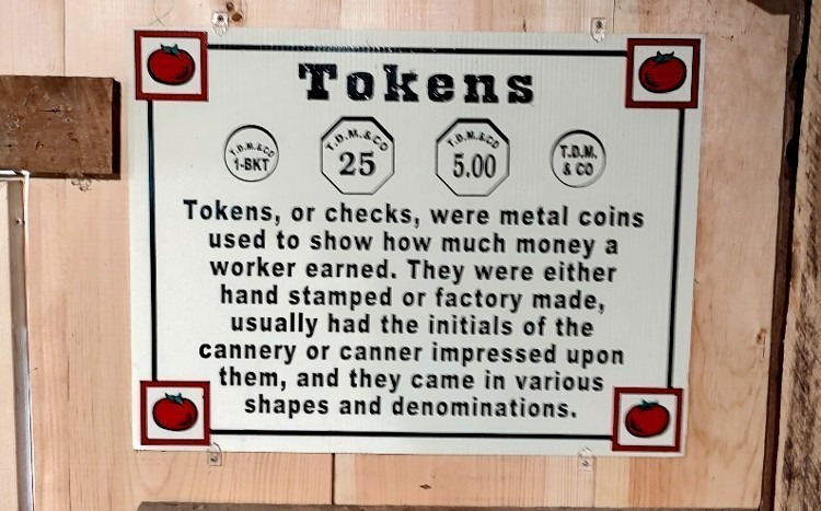 Sign explaining tokens at the Steppingstone Museum cannery exhibit in Havre de Grace - Tokens, or checks, were metal coins used to show how much money a worker earned.