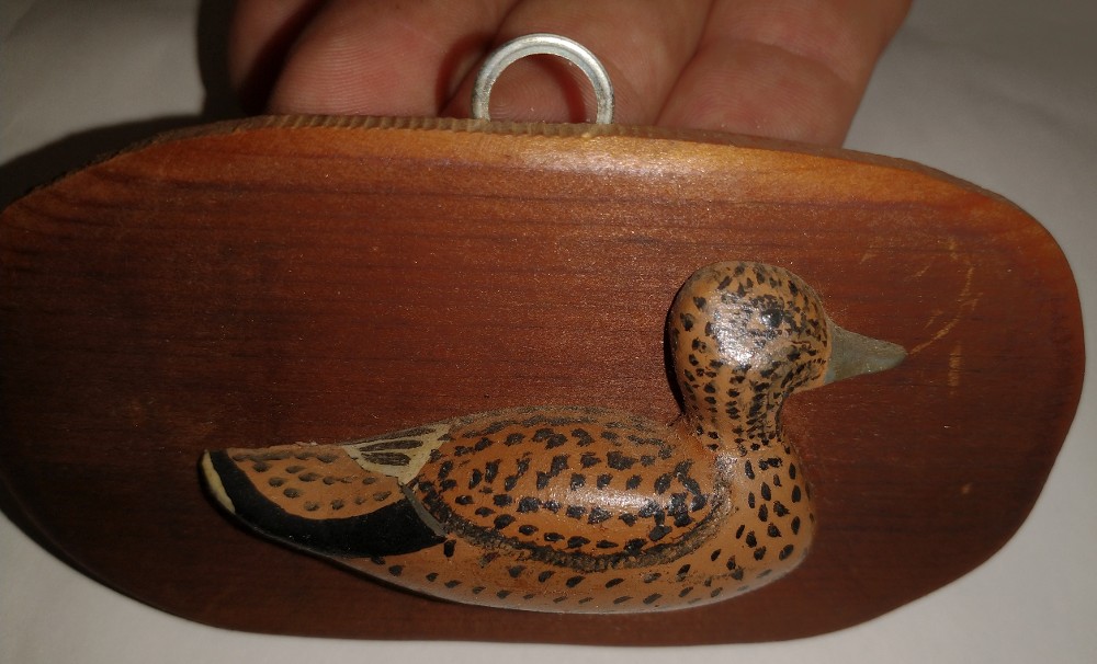 miniature carved duck on a small board by William Schweers - 1983