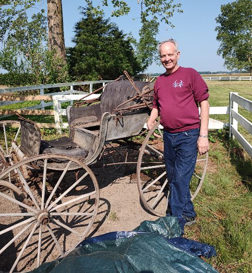 Our casual historian is one very happy guy as he gets a peek at an 1896 Burns Bros carriage.