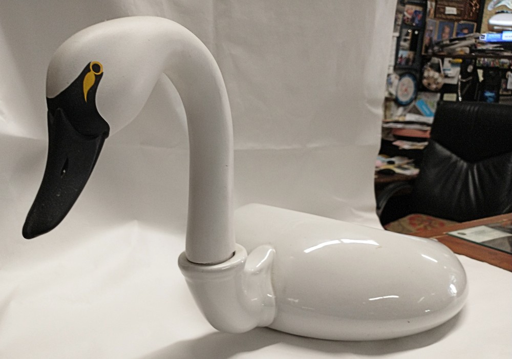 our casual historian's prized piece, his porcelain-wood swan decoy - beautiful swan head and neck by Jim McMillan