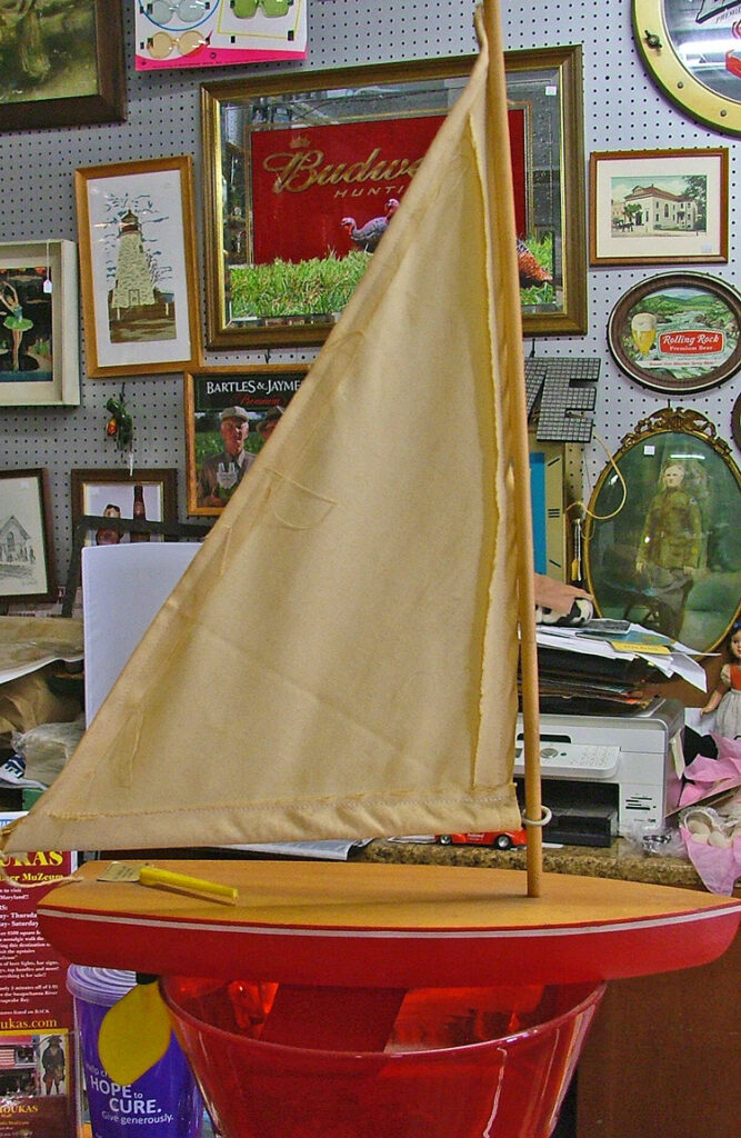 Image of of toy red sailboat that Stevie, our friendly little boy ghost, loves to play with at Bahoukas Antique Mall in Havre de Grace.