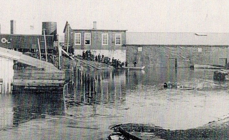 photo of Seneca Cannery at the end of St. Clair (now Pennington) in Havre de Grace with the US Hotel and a boxcar in the background.